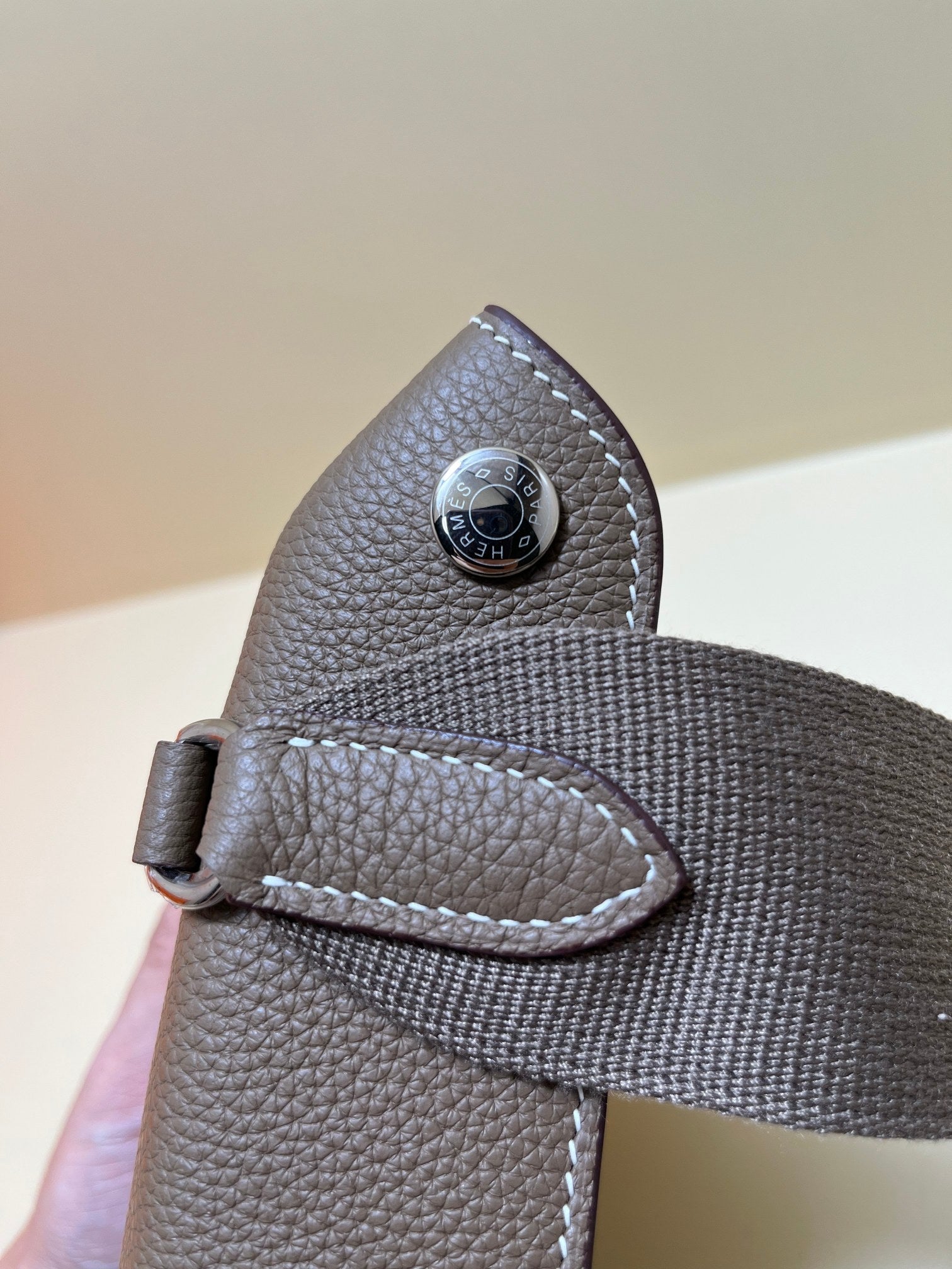 Luxury Pebbled Leather Crossbody Bag with Perforated H Logo - Taupe