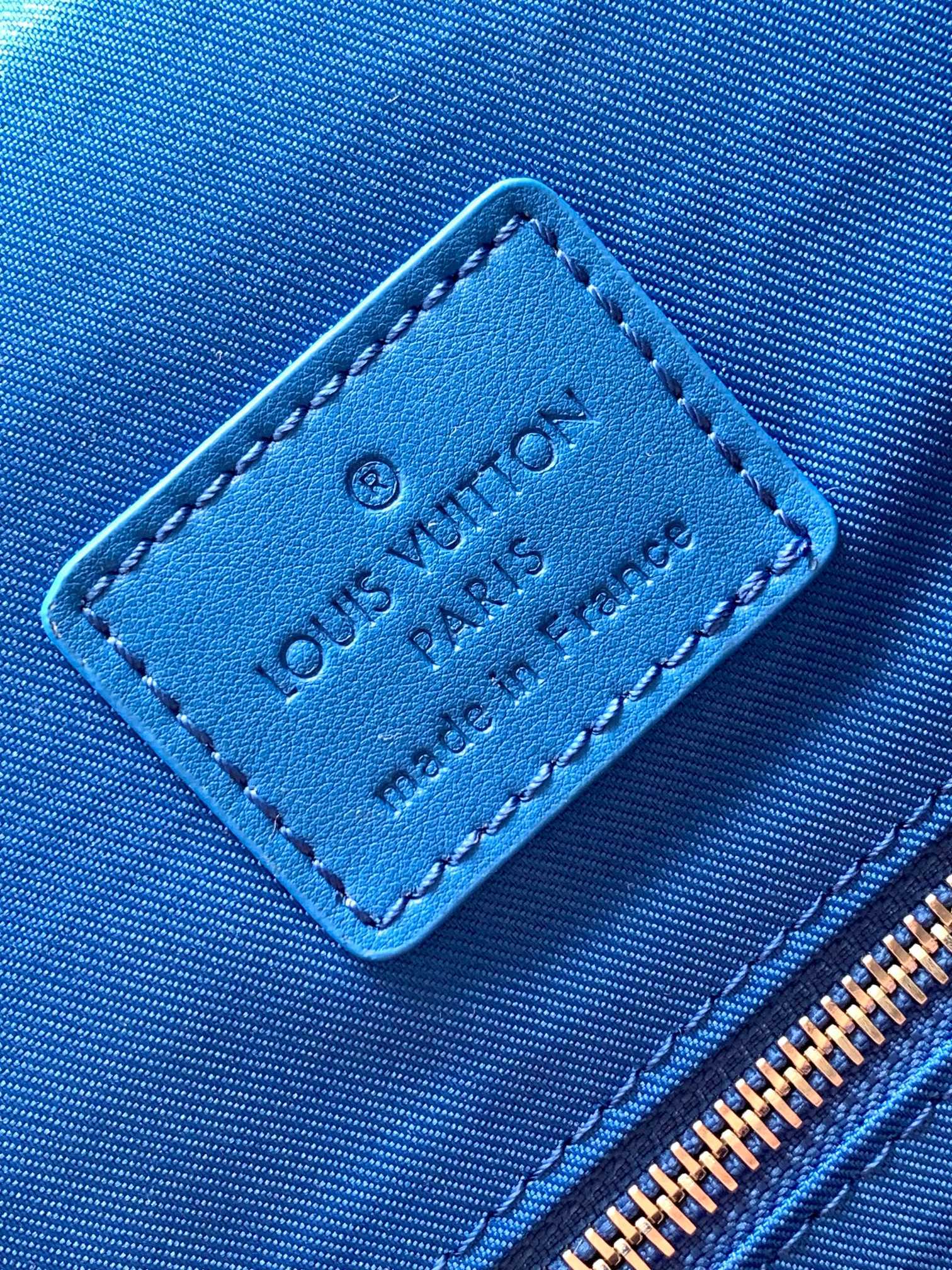 Louis Vuitton Luxury Monogram Canvas Backpack with Bright Blue Leather Straps