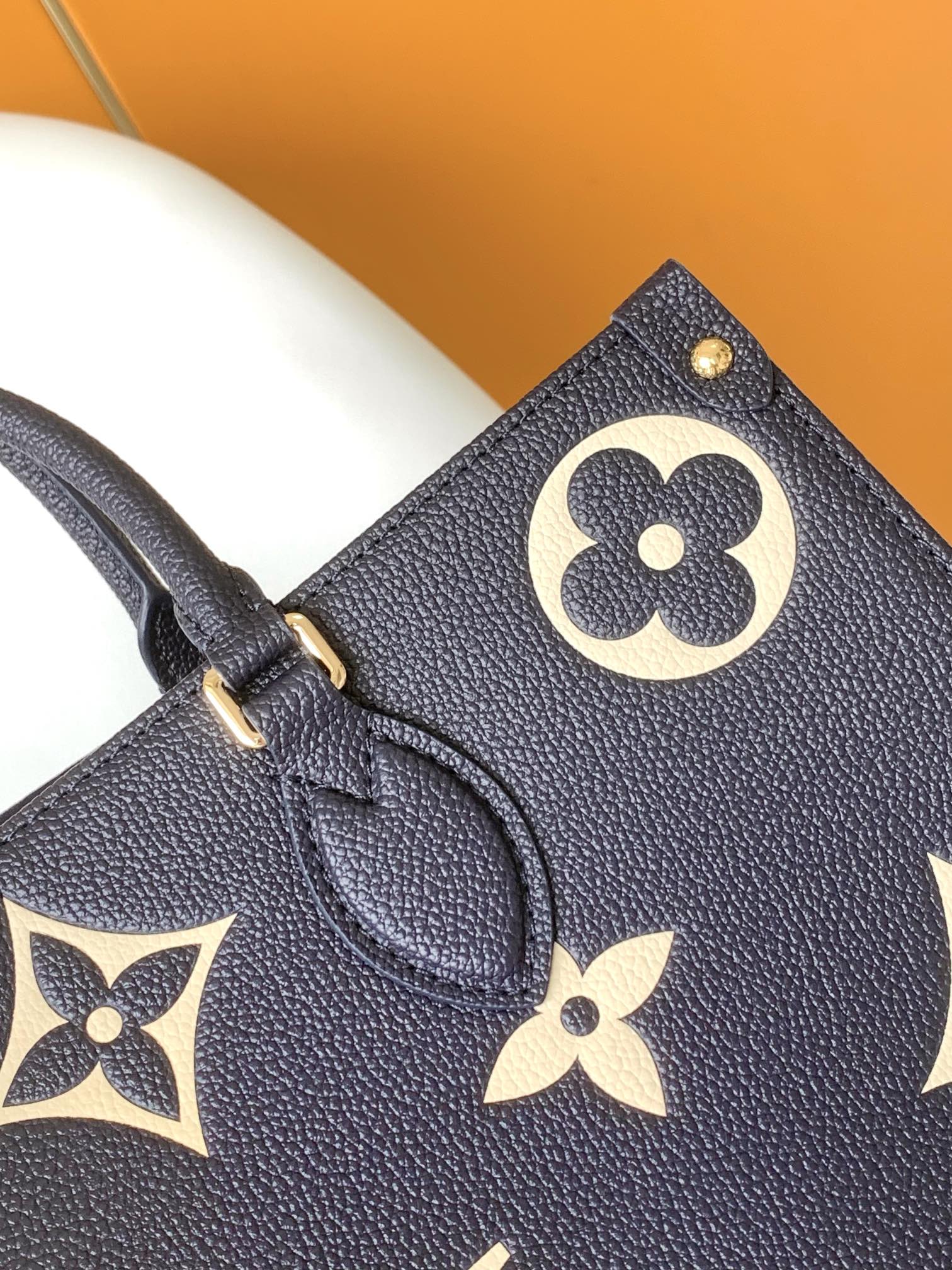 Louis Vuitton Elegant Navy Blue Leather Tote Bag with Floral Monogram Pattern