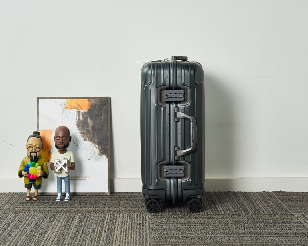 Sleek Black Ribbed Hardshell Carry-On Suitcase with Spinner Wheels