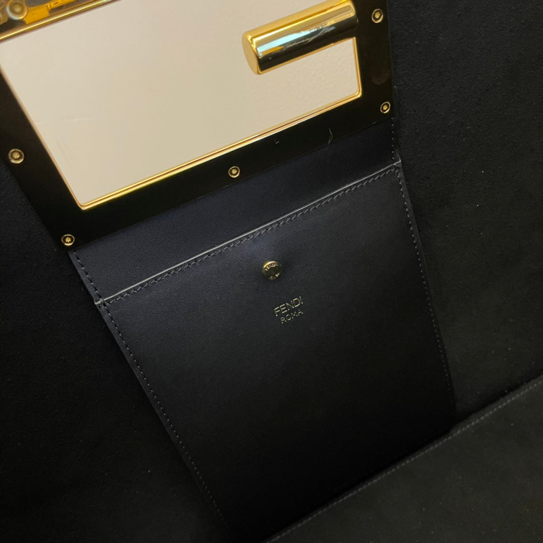 Elegant Black Leather Handbag with Gold Rectangular Clasp and Detachable Shoulder Strap