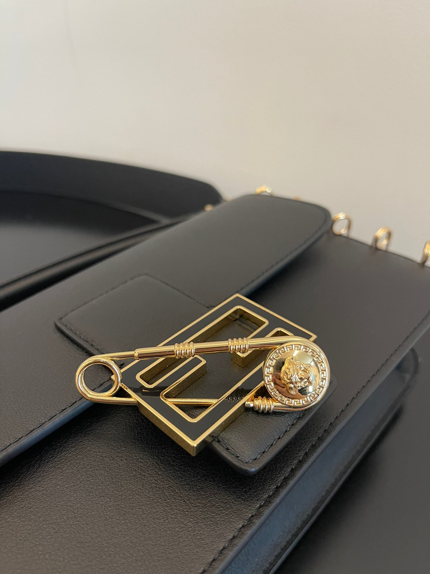 Black Leather Shoulder Bag with Gold Safety Pin Detail &amp; Studded Accents