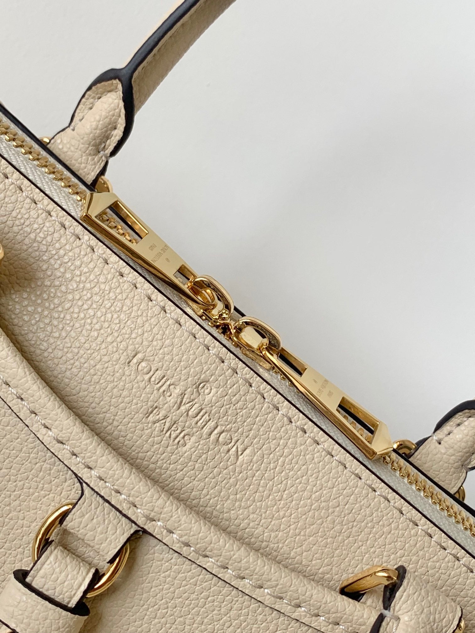 Louis Vuitton Monogram Empreinte Leather Handbag - Elegant Beige Top Handle Tote
