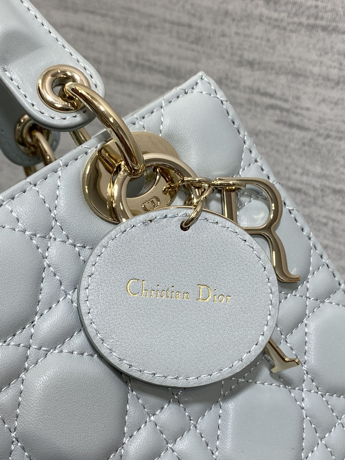 Dior Elegant Light Blue Quilted Leather Handbag with Crossbody Strap