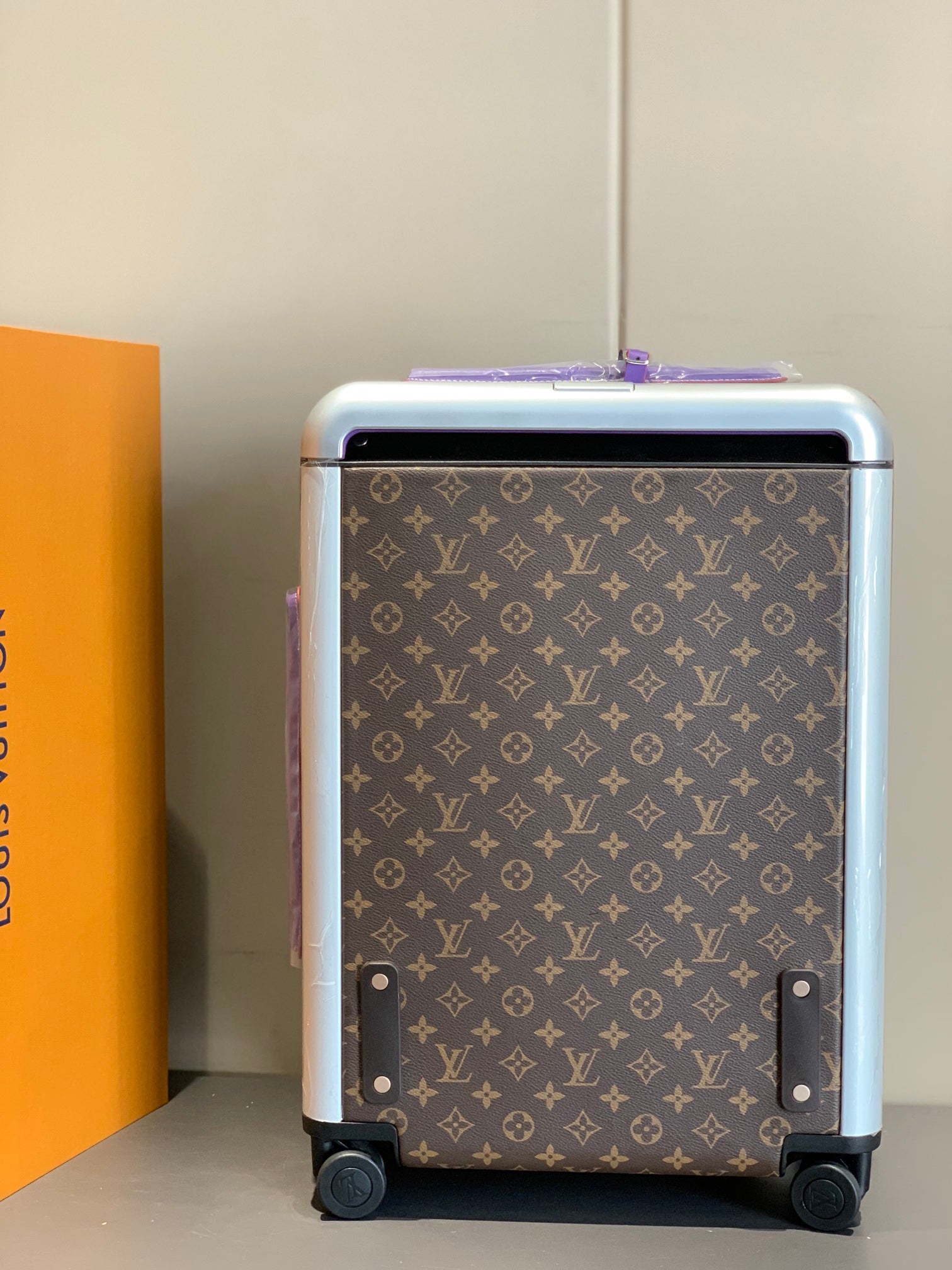 Luxury Brown Monogram Rolling Suitcase with Purple Accents