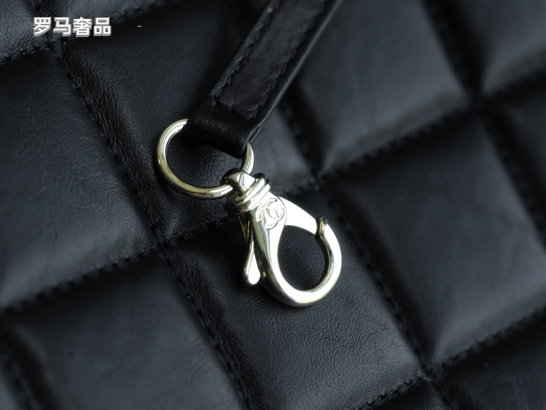 Luxury Black Quilted Leather Handbag with Gold-Tone Chain Strap and Cut-Out Handles