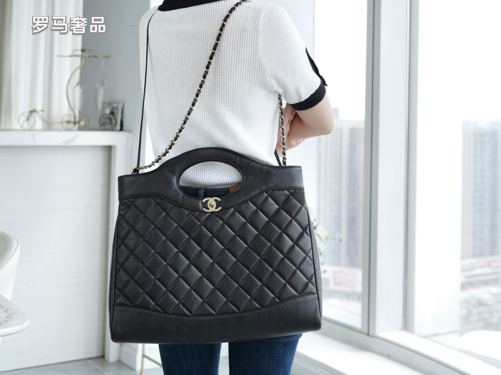 Luxury Black Quilted Leather Handbag with Gold-Tone Chain Strap and Cut-Out Handles