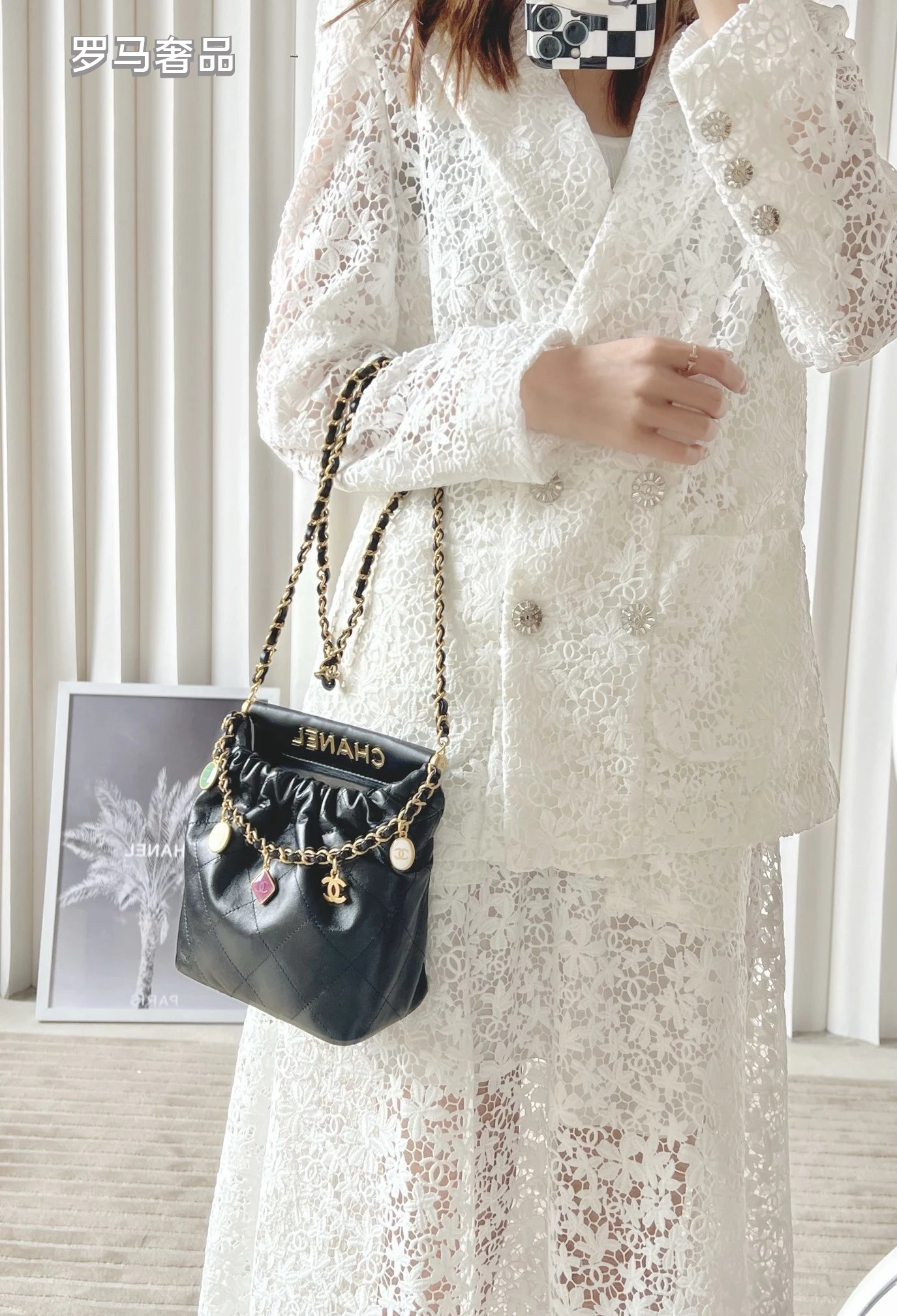 Chanel 22 Small Handbag Black Quilted Leather Gold-Tone Charms